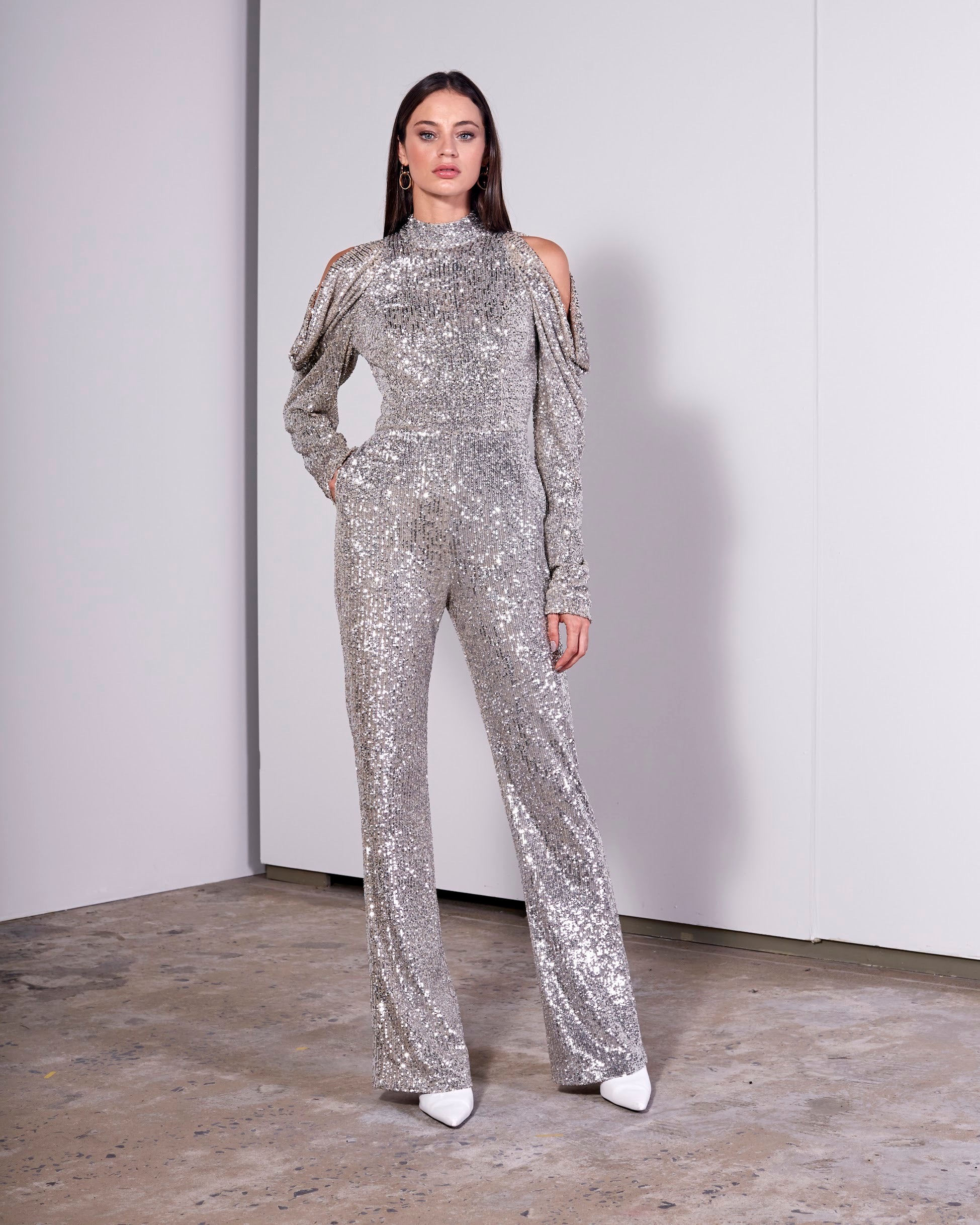 SILVER SMALL SEQUIN JUMPSUIT W/ RUFFLE LS SLEEVE & OPEN BACK